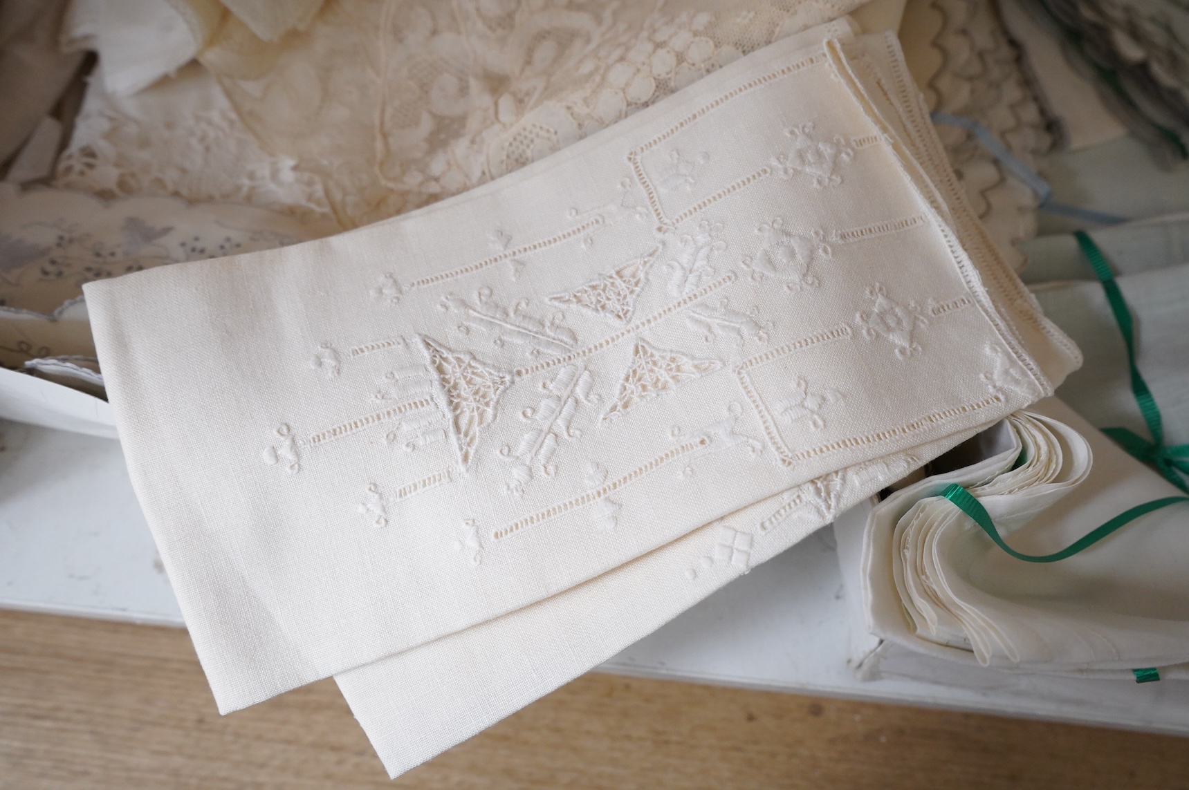 A collection of mixed damask embroidered and cutworked table cloths, napkin sets, hand towels and mats (in 3 boxes)